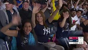 Yankee fans boob shakes as she waves to camera.