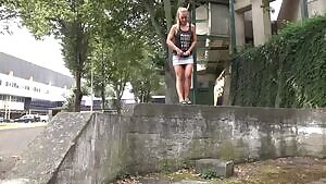 Cute babe Naomi Benet lifts her short skirt to relieve her piss desperation