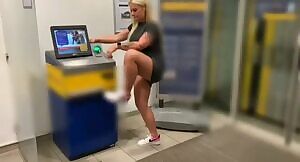 Trashy German takes a piss on an ATM machine