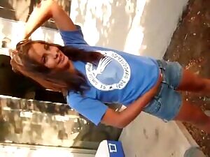 Wetting her jean shorts in public