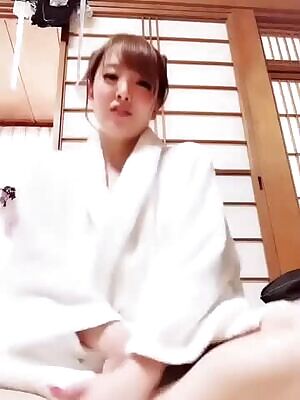 Behind the white robe.