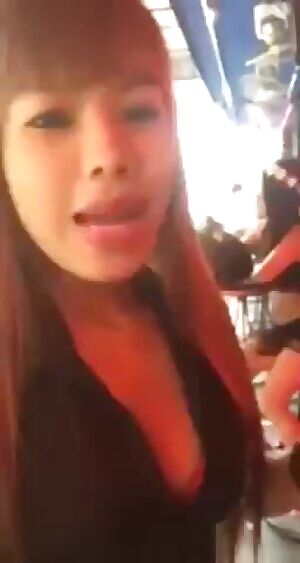 Asian woman greets customers with rapid recitation of XXX services