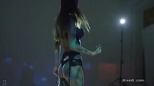 Attractive woman removing her clothing