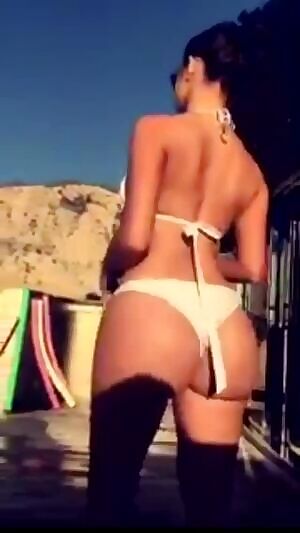 Demi Rose Mawby showing off her ass