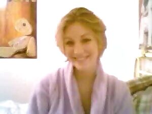 Nice blond cam babe with big tits strips