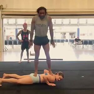 Jumping on her shoulders.