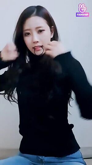 Mijoo looking ethereal while tying her hair up.