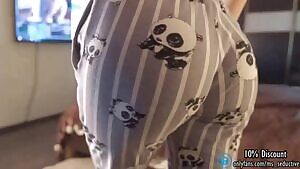 Wearing her tight panda pajamas.