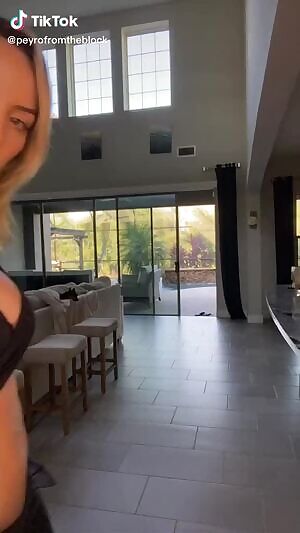 Her trousers are un-buttoned, waiting to be taken off