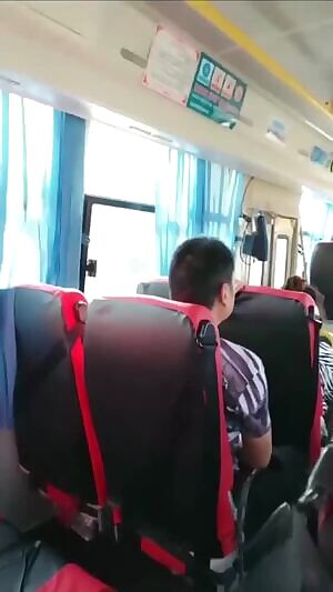 Chinese cutie flashing her tits on a bus