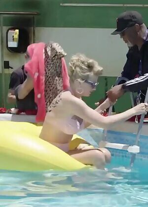 Taylor Swift getting out of a pool