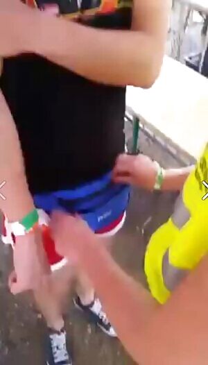 female security checks guys fanny pack at a festival