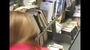 Guy fucks a girl doggy style in a library and busts a load inside of a library book