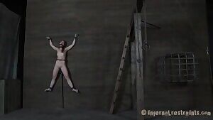 Spreadeagle on the wall with a dildo-stick and a clit vibrator