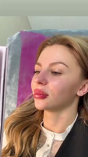 So young and innocent... and admiring her new augmented bimbo lips