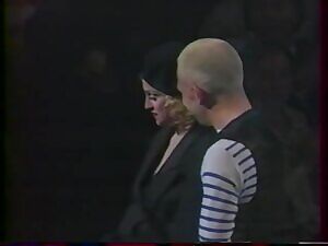 Young Madonna flashing her boobs on stage