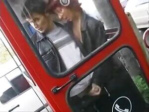 Girl makes guy cum on the window of a phone box