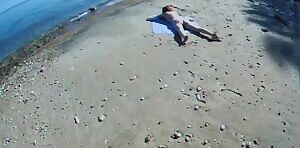 Sunbather gets groped on the beach