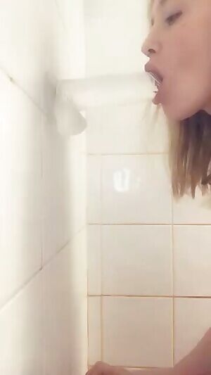 Good girl with her toy in the shower