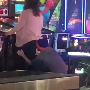 Is he sniffing her farts while she pinballs?!