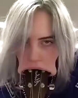 Billie Eilish Blows A Guitar