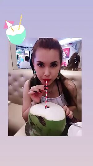 Maria enjoying a coconut