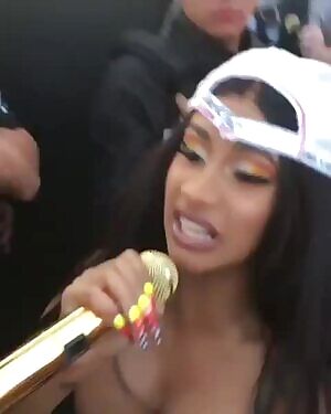 Cardi B and her boobs performing