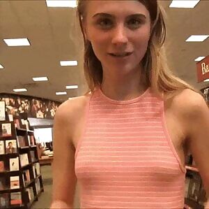 Braless cutie showing off her tiny tits in public