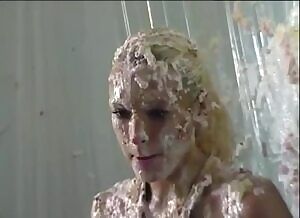 Elegant woman getting pied
