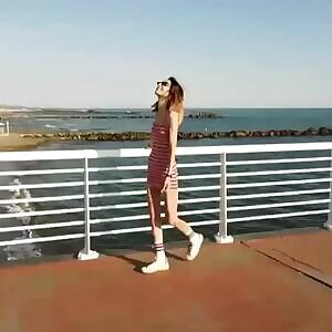 Showing slightly through her dress