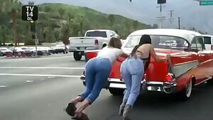 Kim & Khloe Kardashian pushing car