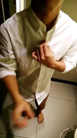 Asian boy strips off and reveals his hard little dick