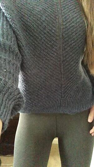 Stripping out of her leggings and pretty blue sweater - WOW!