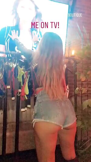 Watching herself on TV