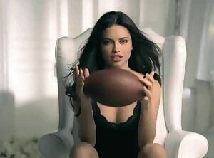 Adriana Lima showing her plot at Superbowl