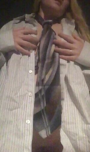 Taking of men's work shirt and tie til naked