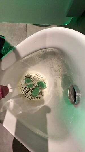 Having a piss at the Heineken Experience in Amsterdam