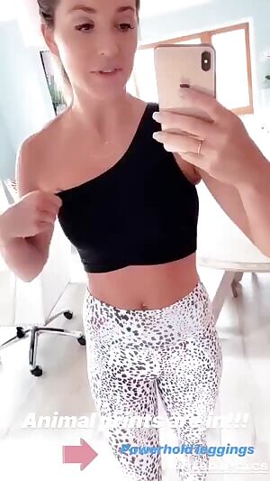 Angela squeezing her boob.