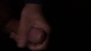 Cum while in the dark holding a light against your cock