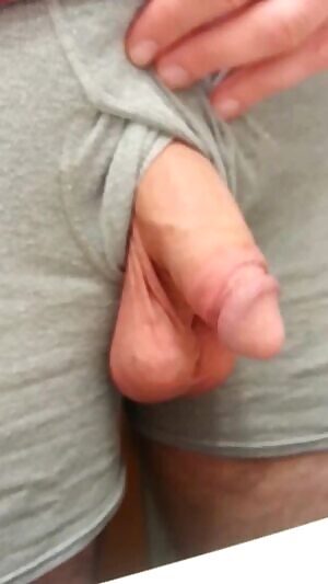 Playing with my low-hanging balls and soft cock