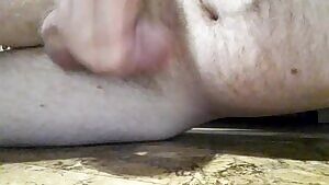 Laying on the floor cumming