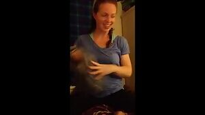 Stripping off her shirt and sports bra