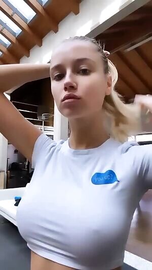 Fixing her ponytail