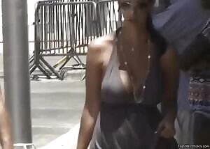 She probably wanted to dress light because of the hot weather. I bet she gets annoyed it isn't possible without wobbling her boobs for everyone to see...