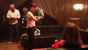 Jennifer Lopez working on a scene in Hustlers with a see through dress on.