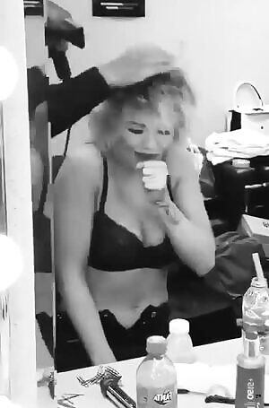 Rita Ora blowing