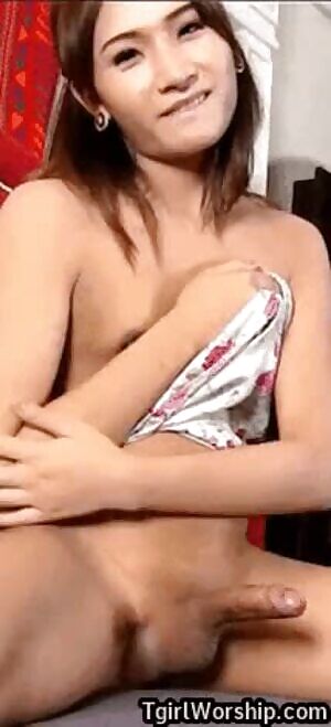 Asian girl wags her cock because she's happy