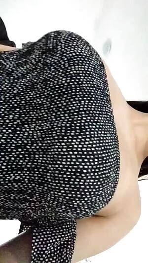 Pierced titties dropping out of a dress