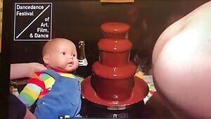 Female Butt Farts on Chocolate Fountain, Hitting Doll in Process